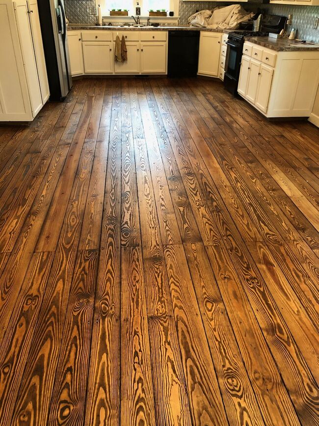 Burnt plywood floors: a bold statement of sophistication.