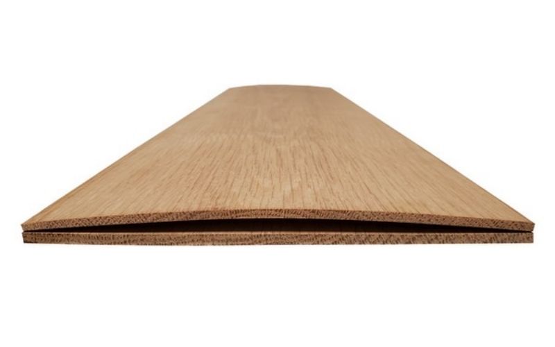 What causes plywood to warp?